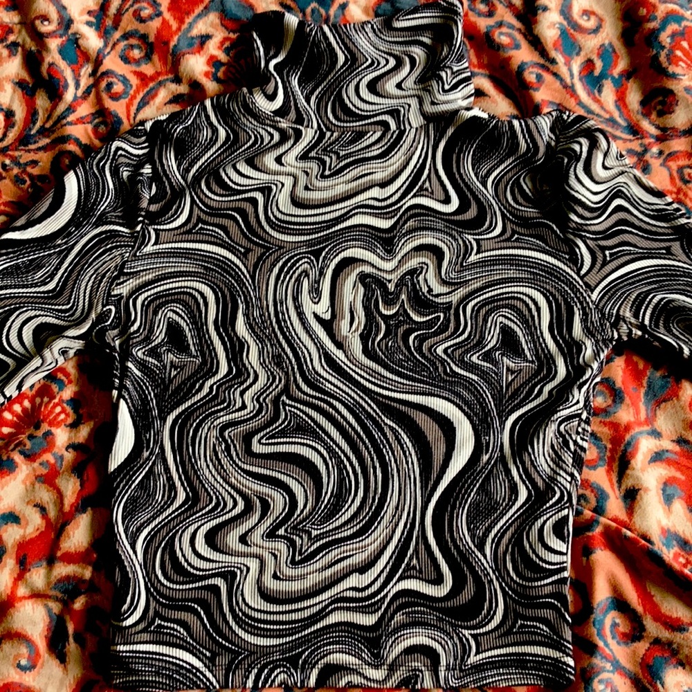 Medium length turtle neck black and white design. Not see through, super comfy